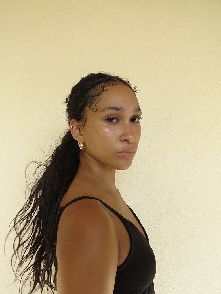 Digital — three-quarter headshot looking over the shoulder